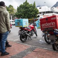 Immigrant food couriers risk death on South African roads