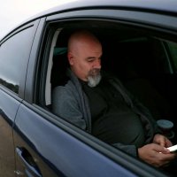 He drives 60 hours a week for Uber. He’s still homeless